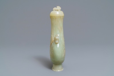 A Chinese archaic celadon jade vase and cover, 19th C.