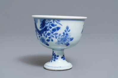 A Chinese blue and white stem cup with birds among blossoms, Transitional period