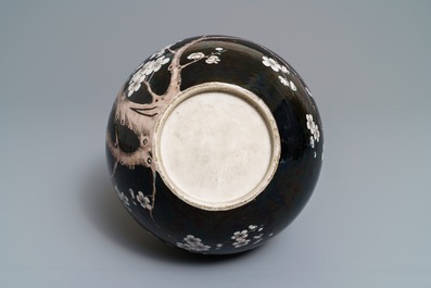 A Chinese famille noire tianqiu ping vase with birds among blossoms, 19th C.