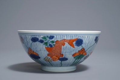 A Chinese doucai bowl with fish in a lotus pond, Xuande mark, Kangxi