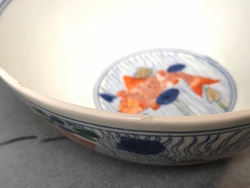 A Chinese doucai bowl with fish in a lotus pond, Xuande mark, Kangxi