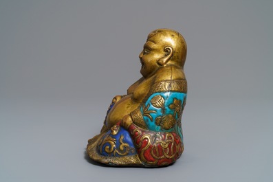 A Chinese champlev&eacute; enamelled copper figure of Buddha, Qianlong