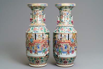 A pair of Chinese famille rose lady-handle vases, 19th C.