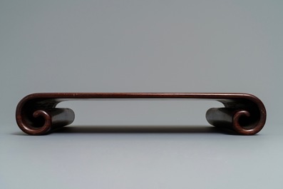 A Chinese carved hardwood stand, 19th C.
