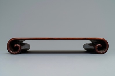 A Chinese carved hardwood stand, 19th C.