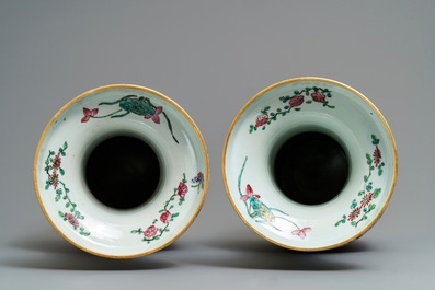 A pair of Chinese famille rose lady-handle vases, 19th C.