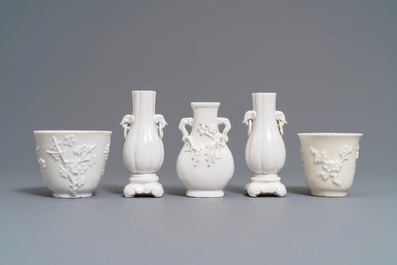 Three Chinese blanc de Chine vases and two cups with applied designs, Kangxi and later