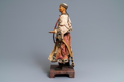 A Chinese Manchu archer doll in painted wood and textile, 19th C.