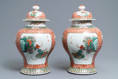 A pair of Chinese famille verte vases and covers, 19th C.