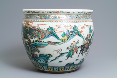 A large Chinese famille verte fish bowl with a narrative scene all-round, 19th C.