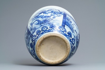 A Chinese blue and white fish bowl with landscape panels, 19th C.