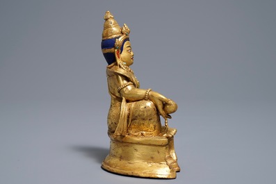 A Sino-Tibetan gilt bronze figure of Jambhala, 19/20th C.