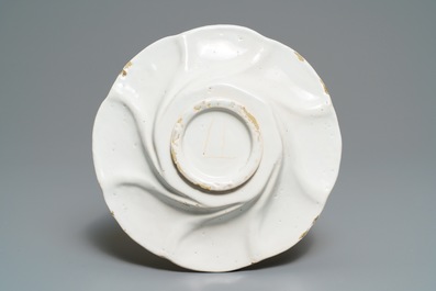 A white Dutch Delft gadrooned dish, 17th C.