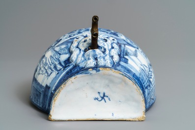 A Dutch Delft blue and white 'putti fountain' wall cistern, 18th C.