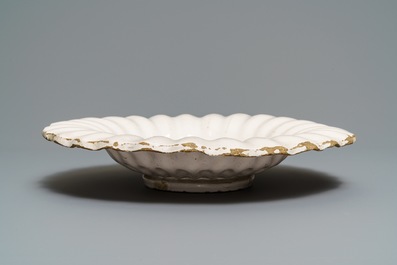 A white Dutch Delft gadrooned dish, 17th C.