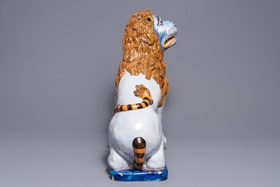 A massive French faience model of a lion, Rouen, 19th C