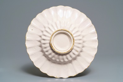 A white Dutch Delft gadrooned dish, 17th C.