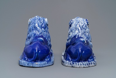 A pair of blue-ground models of recumbent lions, Saint-Omer, France, late 18th C.