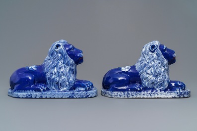 A pair of blue-ground models of recumbent lions, Saint-Omer, France, late 18th C.