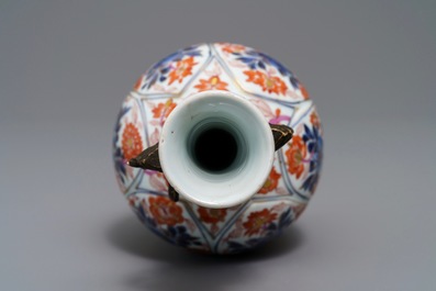 A Chinese floral Imari-style ring-handled vase, Kangxi