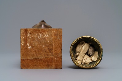 A Tibetan gilt bronze stupa and a lacquered bronze Buddha head, Laos, 16/17th C.