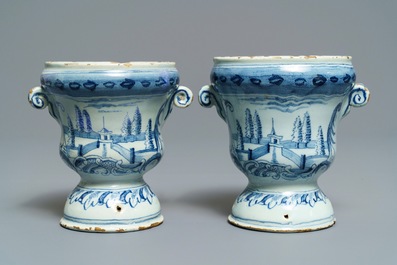 A pair of small Dutch Delft blue and white 'campana' vases on stands, 18th C.