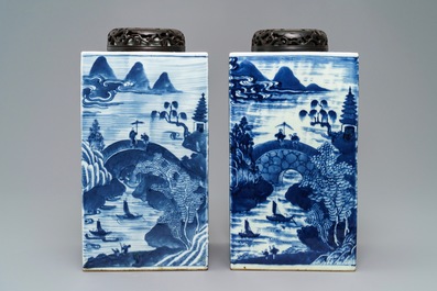 A pair of tall Chinese blue and white tea caddies with landscapes, 19th C.