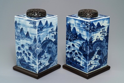 A pair of tall Chinese blue and white tea caddies with landscapes, 19th C.