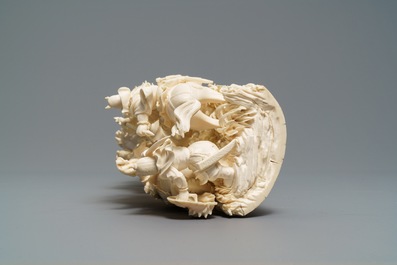 A Chinese carved ivory group with warriors on horseback, 2nd quarter 20th C.
