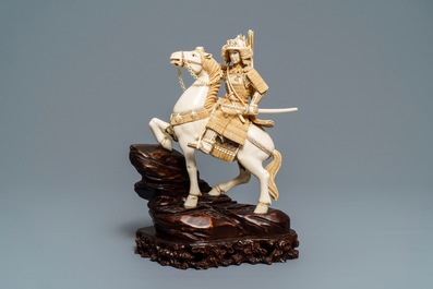 A Japanese ivory figure of a warrior on horseback, 1st half 20th C.