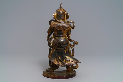 A Chinese gilt-lacquered bronze figure of Weituo, Ming