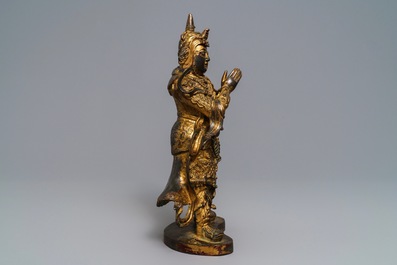 A Chinese gilt-lacquered bronze figure of Weituo, Ming