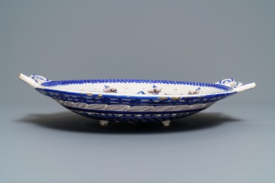 A large blue and manganese Frisian Delft fish strainer, Tichelaar, Makkum, 19th C.