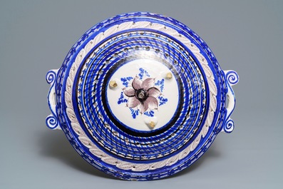 A large blue and manganese Frisian Delft fish strainer, Tichelaar, Makkum, 19th C.