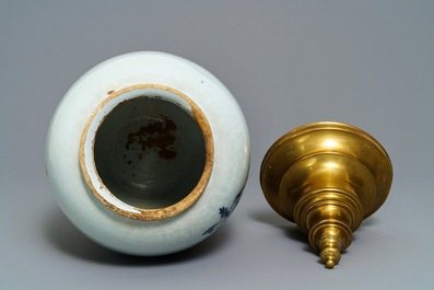 Three Dutch Delft blue and white tobacco jars with brass covers, 18th C.