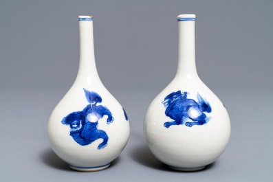 A pair of Chinese blue and white bottle vases with qilins, Kangxi