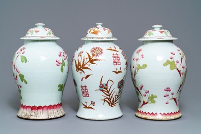 A pair of and a single Chinese famille rose covered vase with floral design, 19th C.