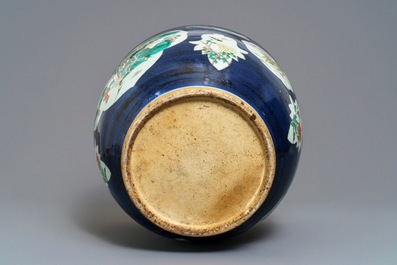 A Chinese blue-ground famille verte fishbowl, 19th C.
