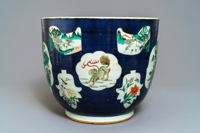 A Chinese blue-ground famille verte fishbowl, 19th C.