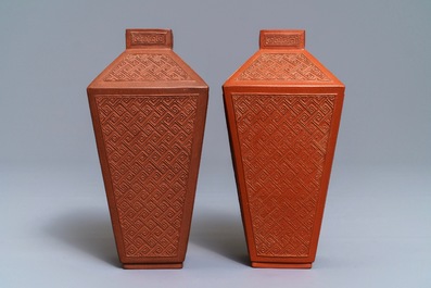 A pair of Chinese Yixing stoneware relief-decorated tea caddies, seal mark, 18th C.