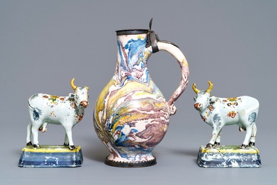 Two pairs of Dutch Delft cows and a pewter-mounted Habaner jug, 18th C.