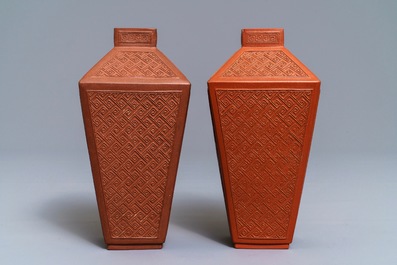 A pair of Chinese Yixing stoneware relief-decorated tea caddies, seal mark, 18th C.