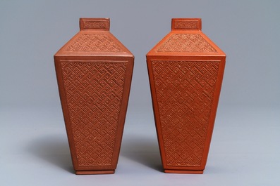 A pair of Chinese Yixing stoneware relief-decorated tea caddies, seal mark, 18th C.