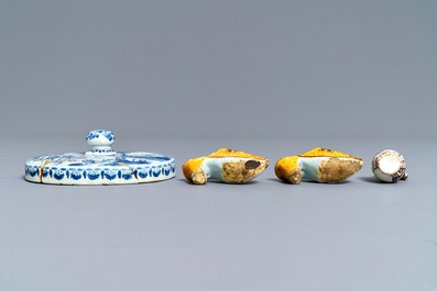 A pair of Dutch Delft polychrome slippers, a miniature jug and a fine lid, 18th C.