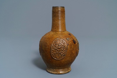 A Belgian stoneware armorial jug with CR monogram, Bouffioulx, 16/17th C.