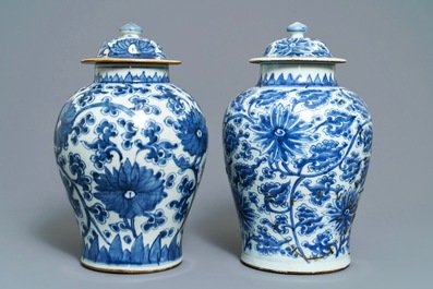 Two Chinese blue and white 'lotus scroll' vases and covers, Kangxi