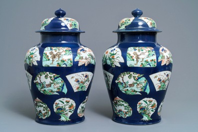 A pair of famille verte powder blue-ground vases and covers, Samson, Paris, 19th C.