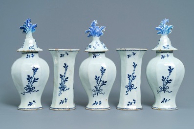 A Dutch Delft blue and white five-piece garniture with pastoral design, 18th C.