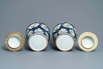 A pair of famille verte powder blue-ground vases and covers, Samson, Paris, 19th C.