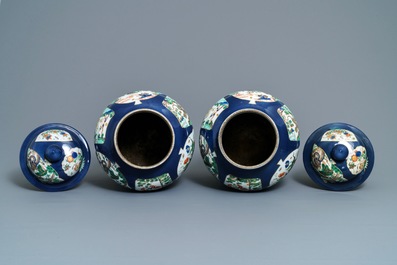 A pair of famille verte powder blue-ground vases and covers, Samson, Paris, 19th C.